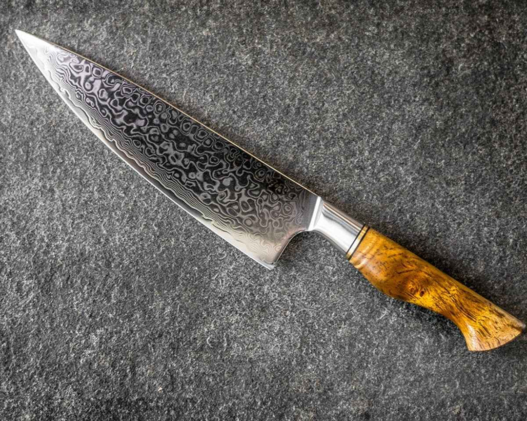 Engraved Damascus chef's knife with burl wood handle